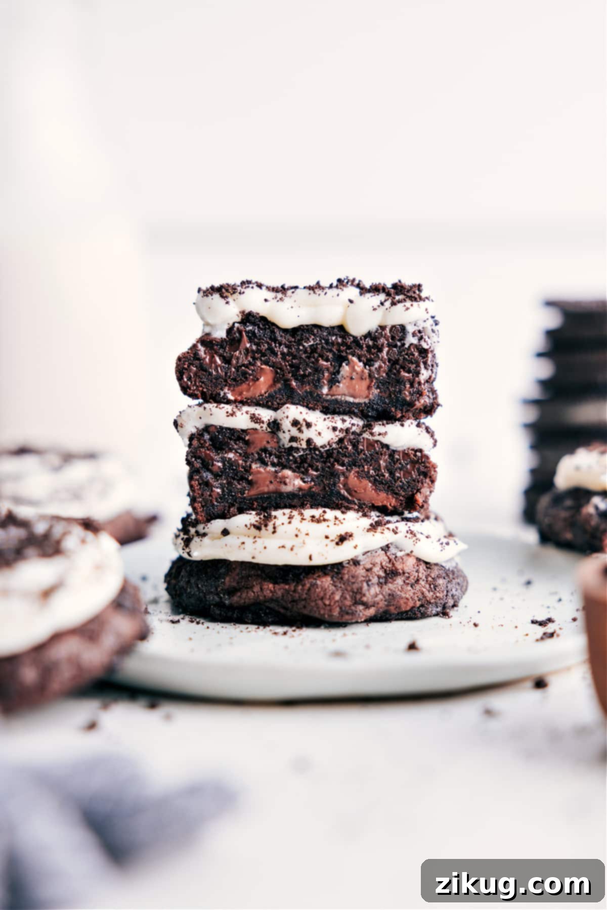 Crumbl Oreo Cookies: Copycat Recipe for Oreo-crumb encrusted rich chocolate cookies with cream cheese frosting and crushed Oreos. Homemade Crumbl Oreo Cookies with rich chocolate base, thick cream cheese frosting, and sprinkled with crushed Oreos.