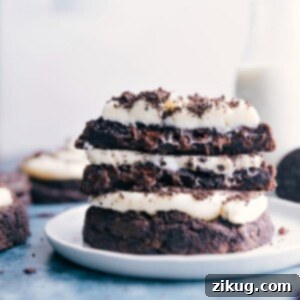 Delicious Crumbl Oreo Cookies, featuring a rich chocolate cookie base, thick cream cheese frosting, and generous crushed Oreo topping.