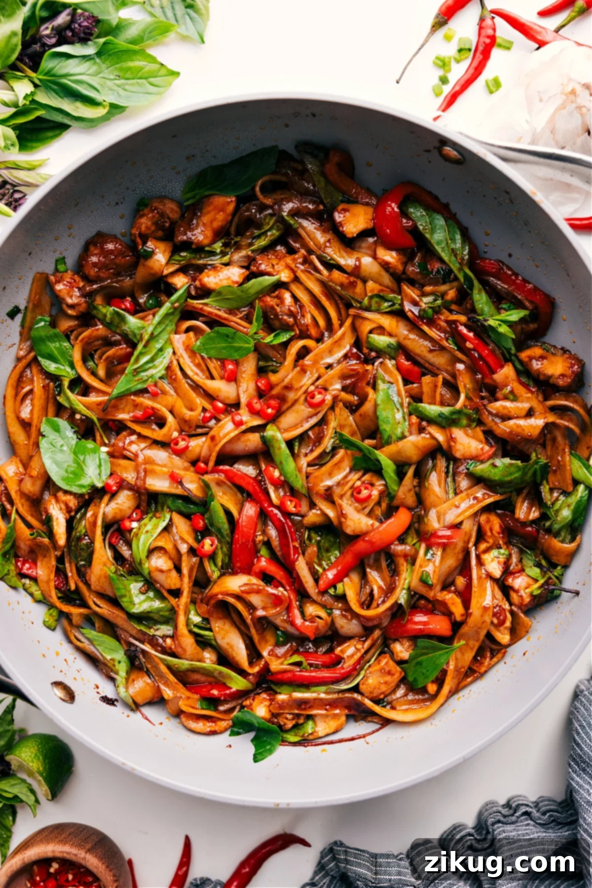 Authentic Thai Drunken Noodles at Home Exotic Thai Drunken Noodles, inspired by a beloved Thai food truck, featuring wide rice noodles, protein, and crisp vegetables.