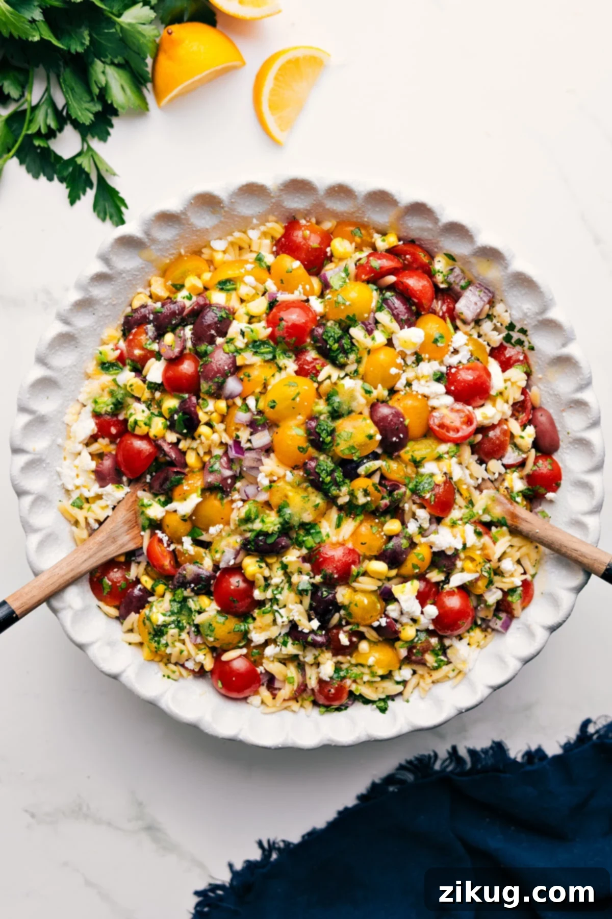 Sister's Favorite Greek Orzo Pasta Salad A vibrant and fresh Greek Orzo Pasta Salad, a delicious mix of tender orzo, juicy tomatoes, olives, sweet corn, herbs, and feta with a simple lemon dressing.