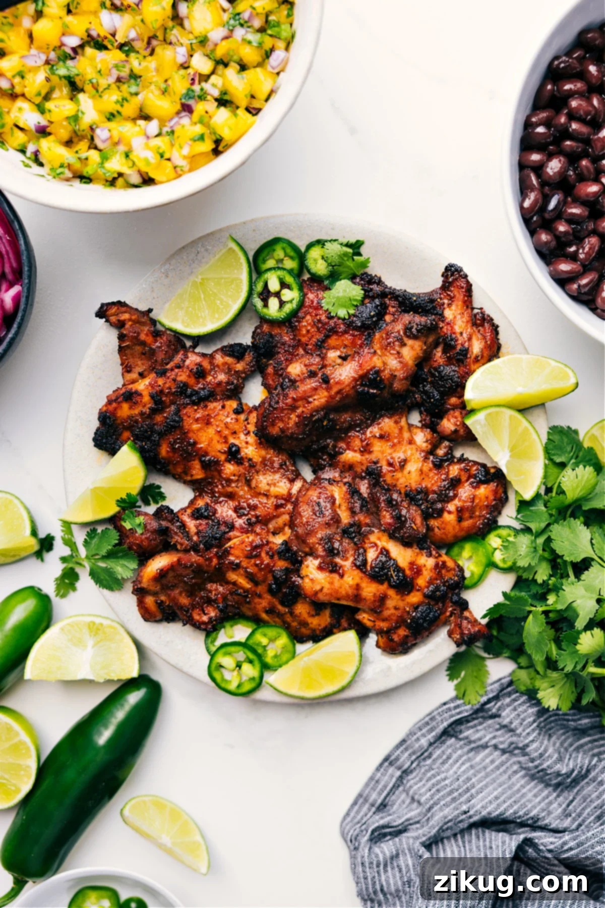 Authentic & Juicy Jerk Chicken Succulent Caribbean-inspired jerk chicken, boasting tantalizing charred edges and incredibly juicy centers, bringing vibrant island flavors to your kitchen.