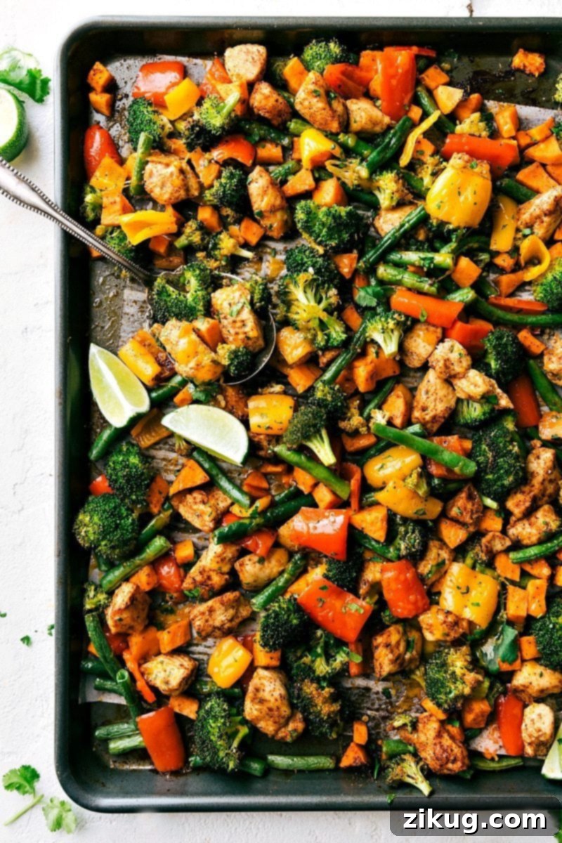 Healthy Sheet Pan Chicken and Veggies A healthy one-pan dinner featuring juicy chicken and tender, colorful vegetables, all baked with cheesy flavor for a simple meal everyone loves.