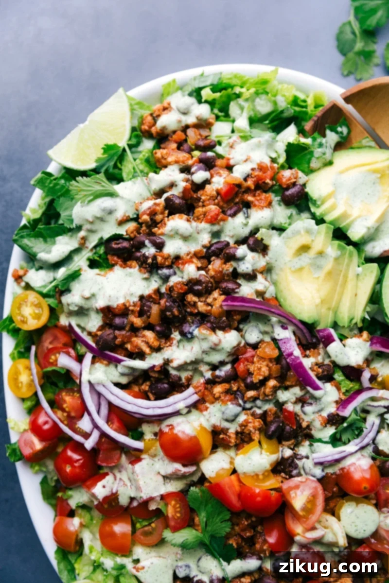Taco Salad Recipe A vibrant and colorful turkey taco salad, perfectly dressed and artfully arranged, ready to be served.