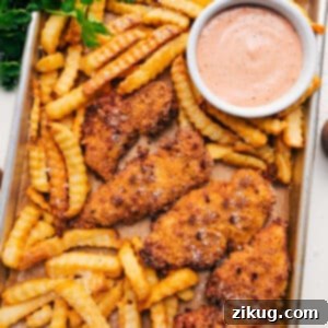 Crispy Parmesan Chicken Tenders with dipping sauce.