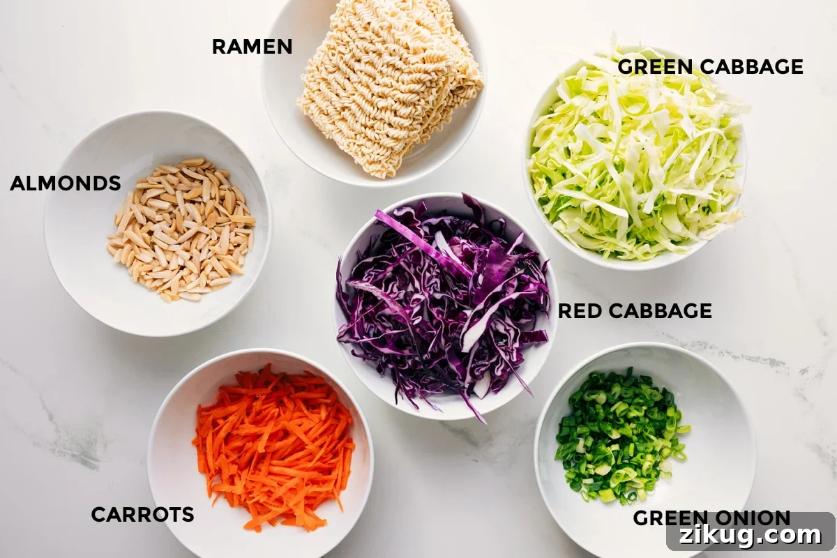 Ingredients In This Ramen Noodle Salad Recipe All the ingredients in this recipe prepped out for easy assembly including the almonds, carrots, cabbage, green onions, and ramen.