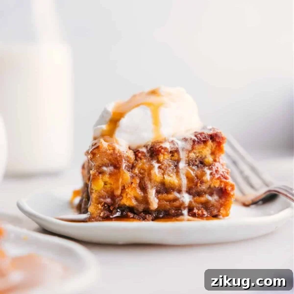 Homemade Cosmic Brownies Recipe with Fudgy Chocolate Filling 6 A slice of bread pudding topped with a scoop of ice cream, served warm as a delicious dessert.