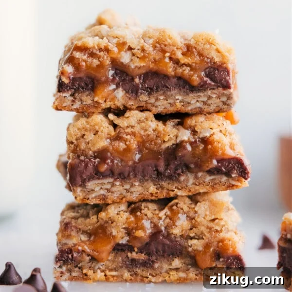 Homemade Cosmic Brownies Recipe with Fudgy Chocolate Filling 4 Carmelitas stacked on top of each other.