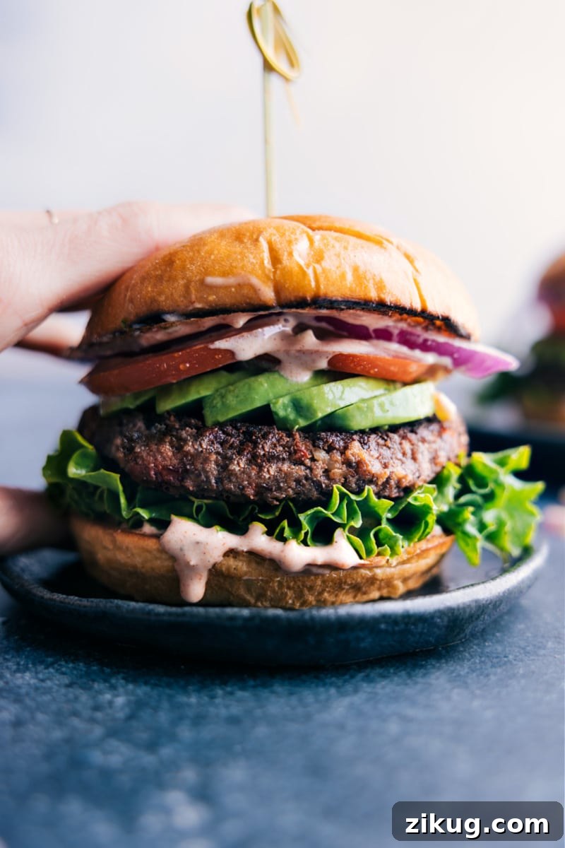 Black Bean Burger REcipes Vegetarian recipes: black bean burger with fresh veggies on a buttered bun.