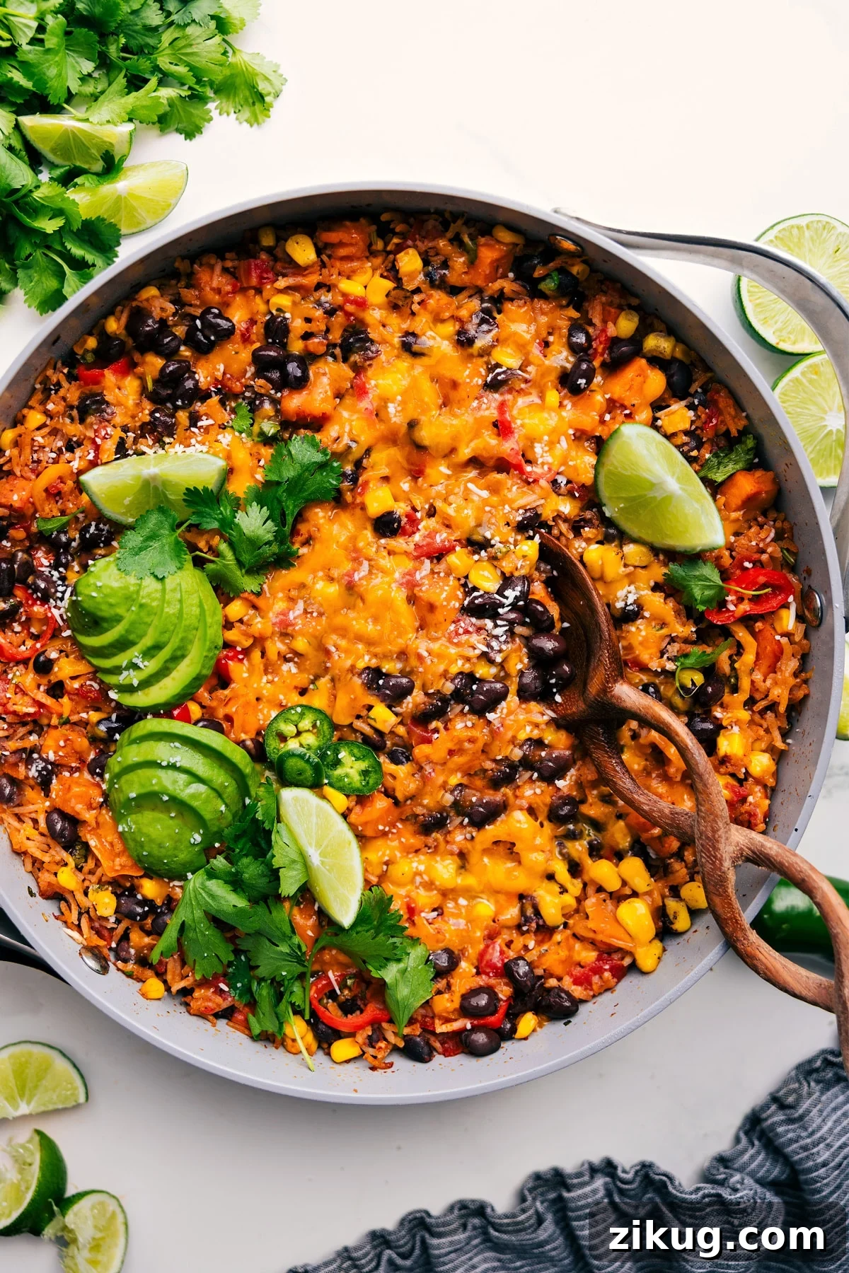 Sweet Potato Burrito Bowl Vegetarian recipes: sweet potato burrito bowls in one skillet topped with avocado, jalapeno, and lime.