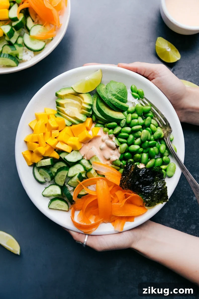 Dense Bean Salad Vegetarian sushi bowl with all the ingredients arranged together and the sauce in the middle.