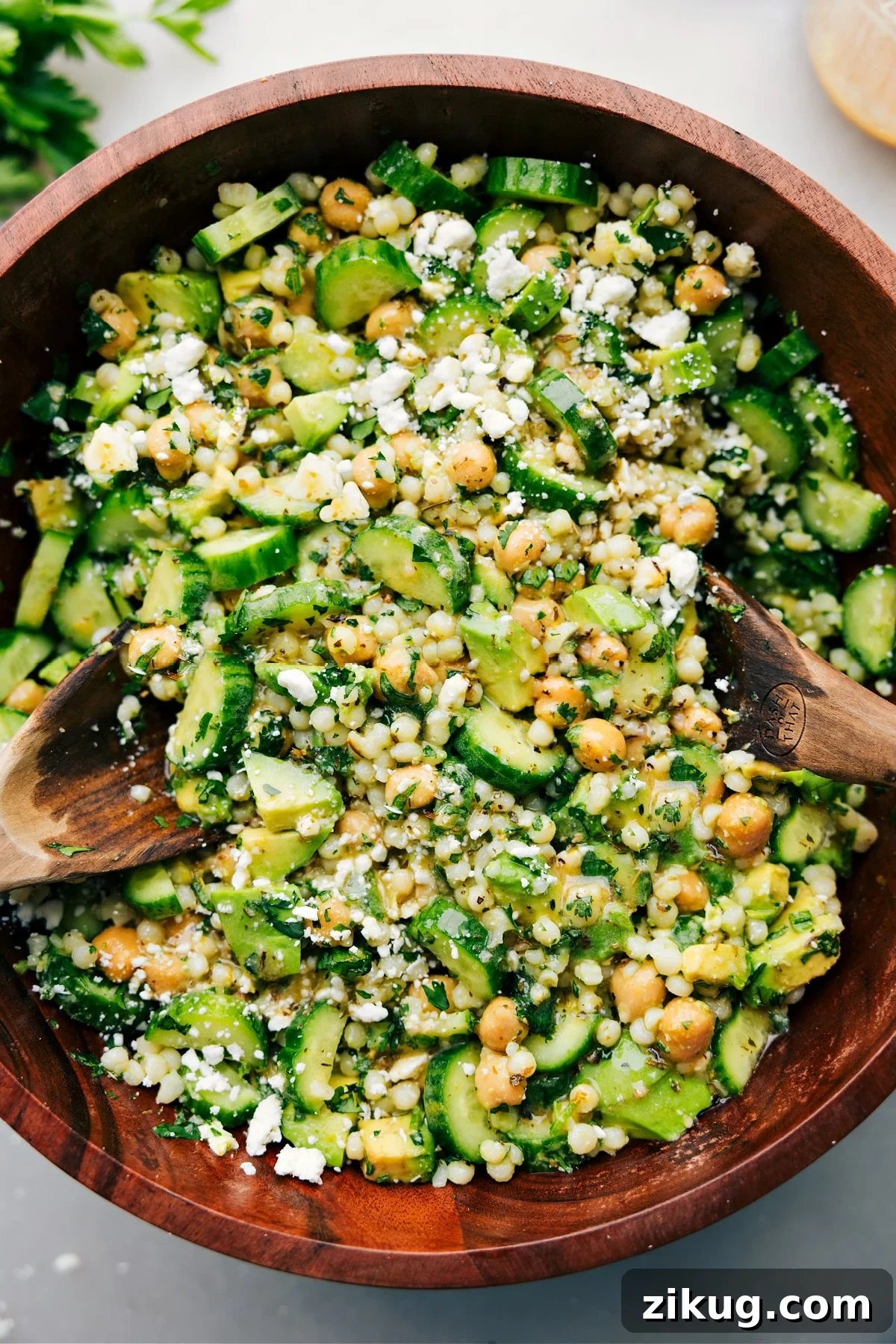 30-Minute Rotisserie Chicken Tacos Cucumber feta salad tossed with dressing and ready to be served.