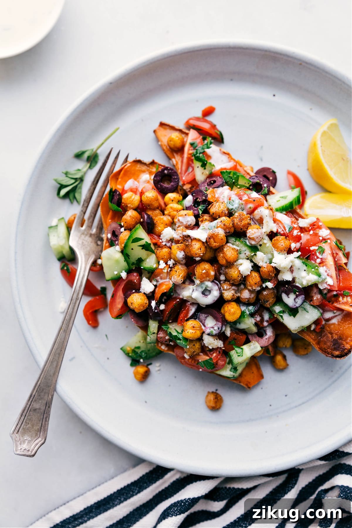Mediterranean Sweet Potatoes Vegetarian recipes: Mediterranean sweet potatoes topped with crispy chickpeas and dressing.
