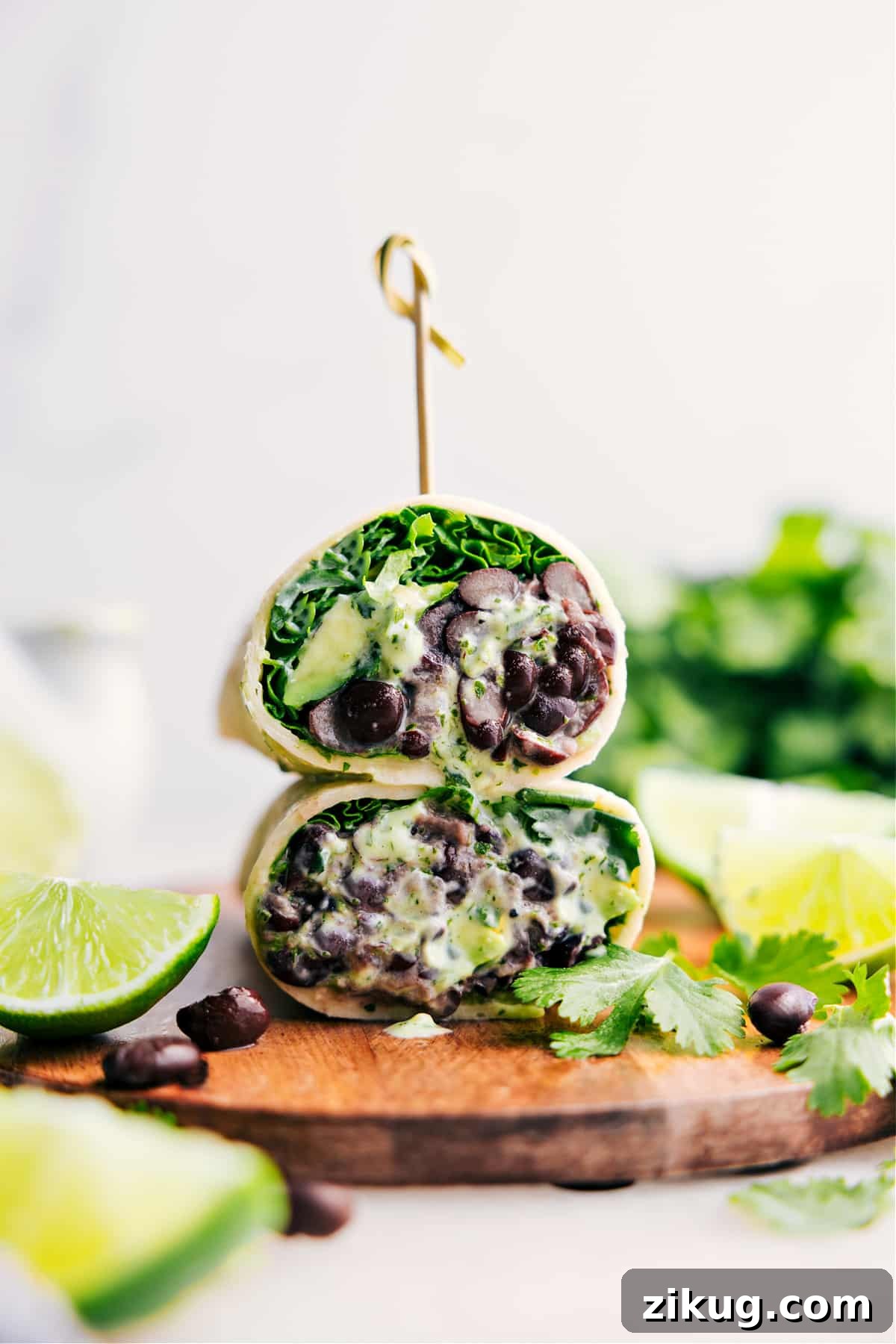 Black Bean Wraps Black Bean Wraps cut in half and stacked with a creamy sauce.