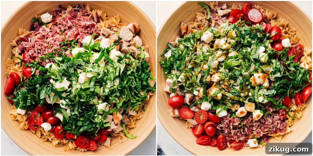 Fresh And Flavorful Caprese Pasta Salad Is The Perfect Summer Dinner The salad in a bowl with all the ingredients added in and the dressing drizzled on top.