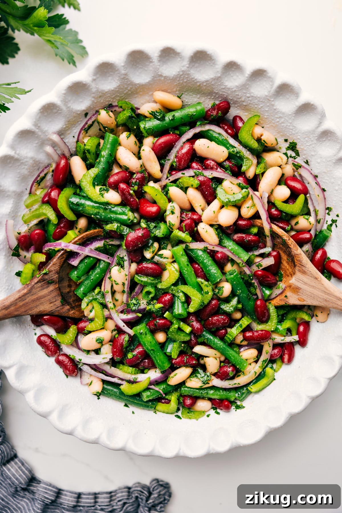 Three Bean Salad Recipe Three bean salad tossed with dressing in a bowl, ready to serve.