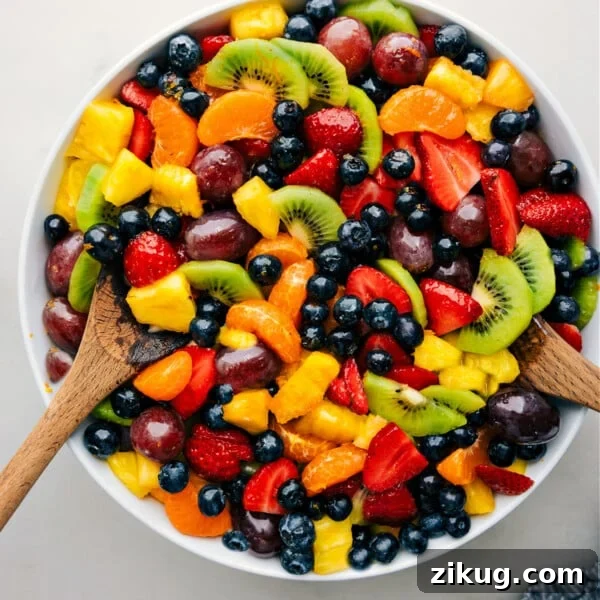 Copycat Hamburger Helper: Creamy One-Pot Ground Beef Skillet 7 The easy fruit salad recipe in a bowl with serving spoons.