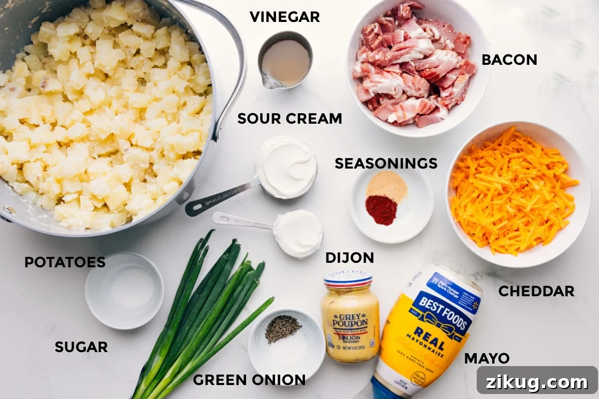 Ingredients In This Loaded Potato Salad All the ingredients in this recipe prepped out for easy assembly including the potatoes, sugar, green onions, mayo, cheddar, seasonings, sour cream, vinegar, and bacon.