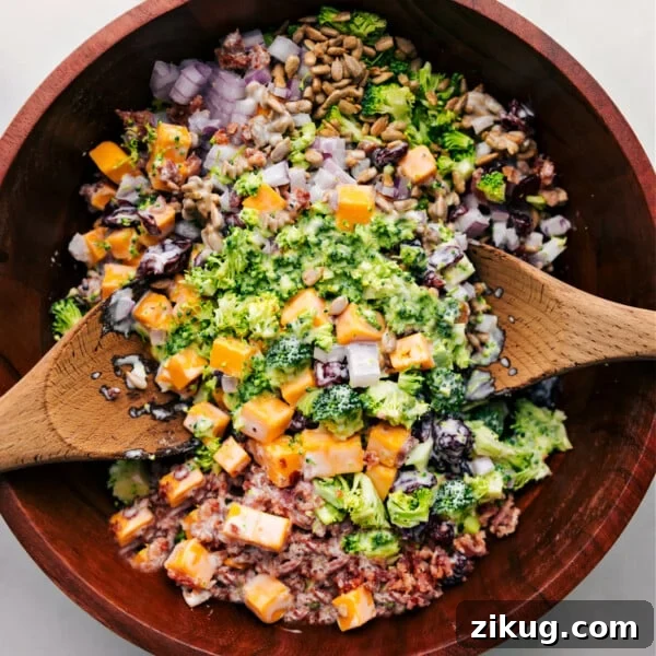 Broccoli and bacon salad in a bowl ready to be tossed together.