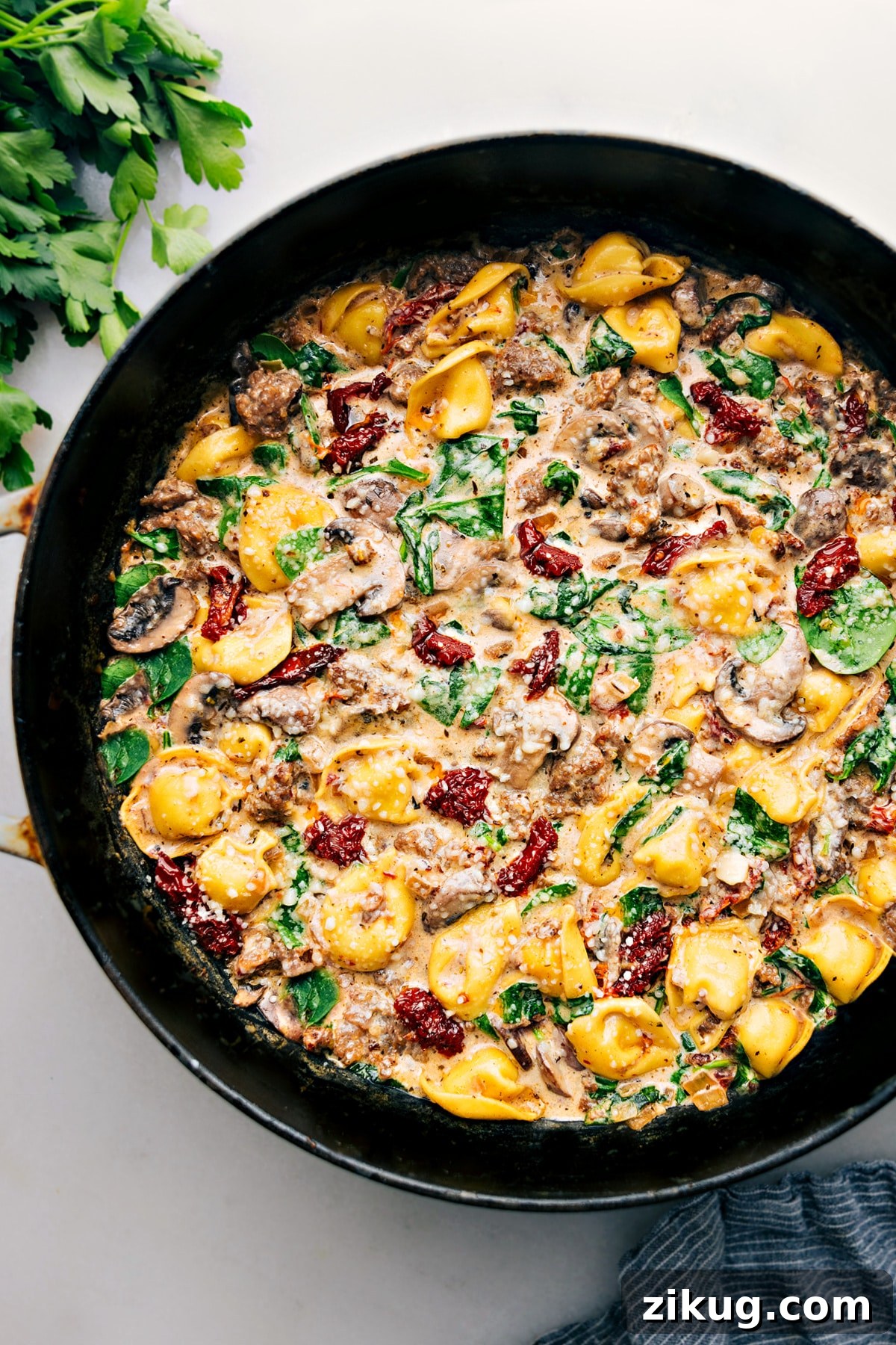 Sausage Tortellini Bake Tortellini bake with sausage, cheese tortellini, creamy sauce, and melted cheese.