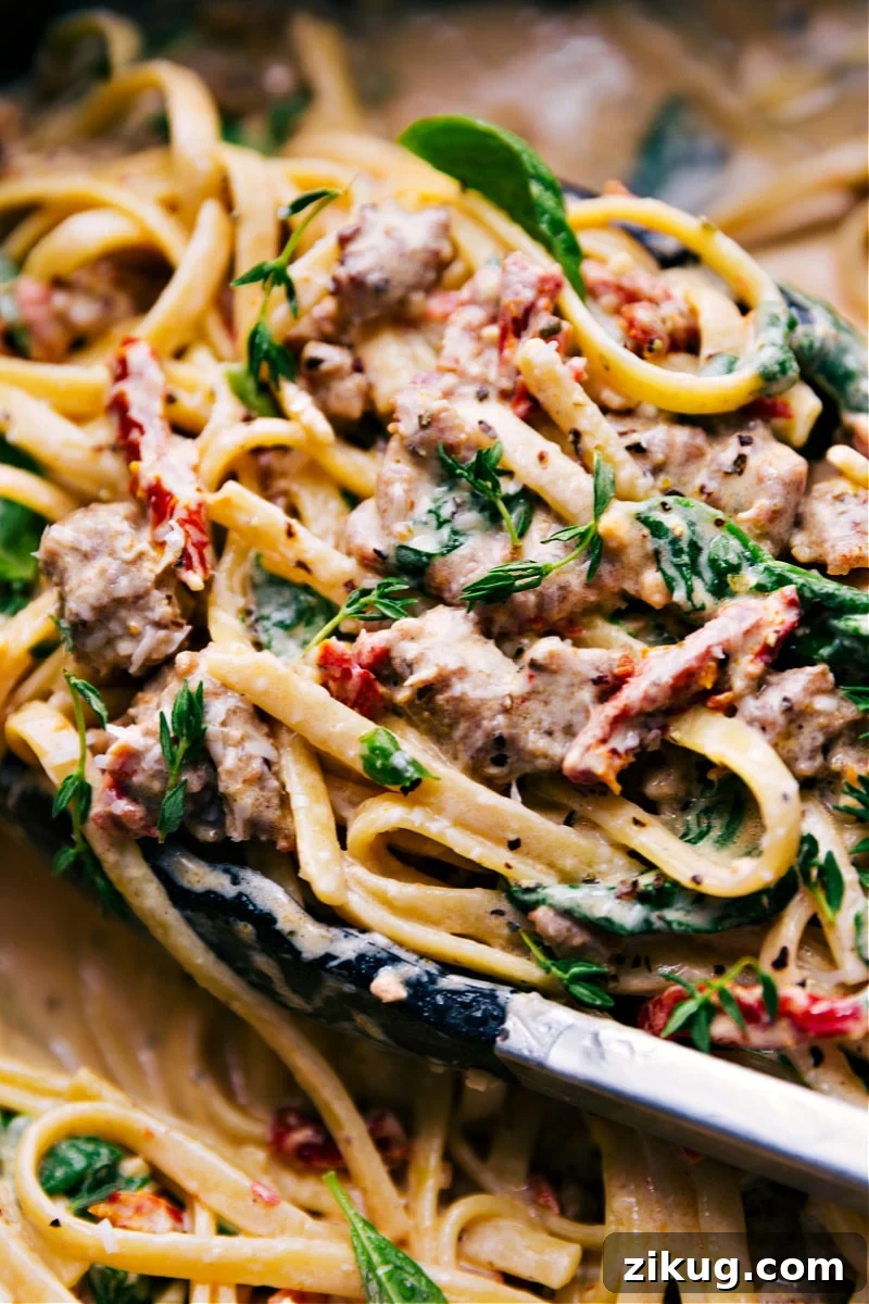 Creamy Sausage Pasta Creamy pasta with fettuccine, sausage, sun-dried tomatoes, spinach, and sauce.