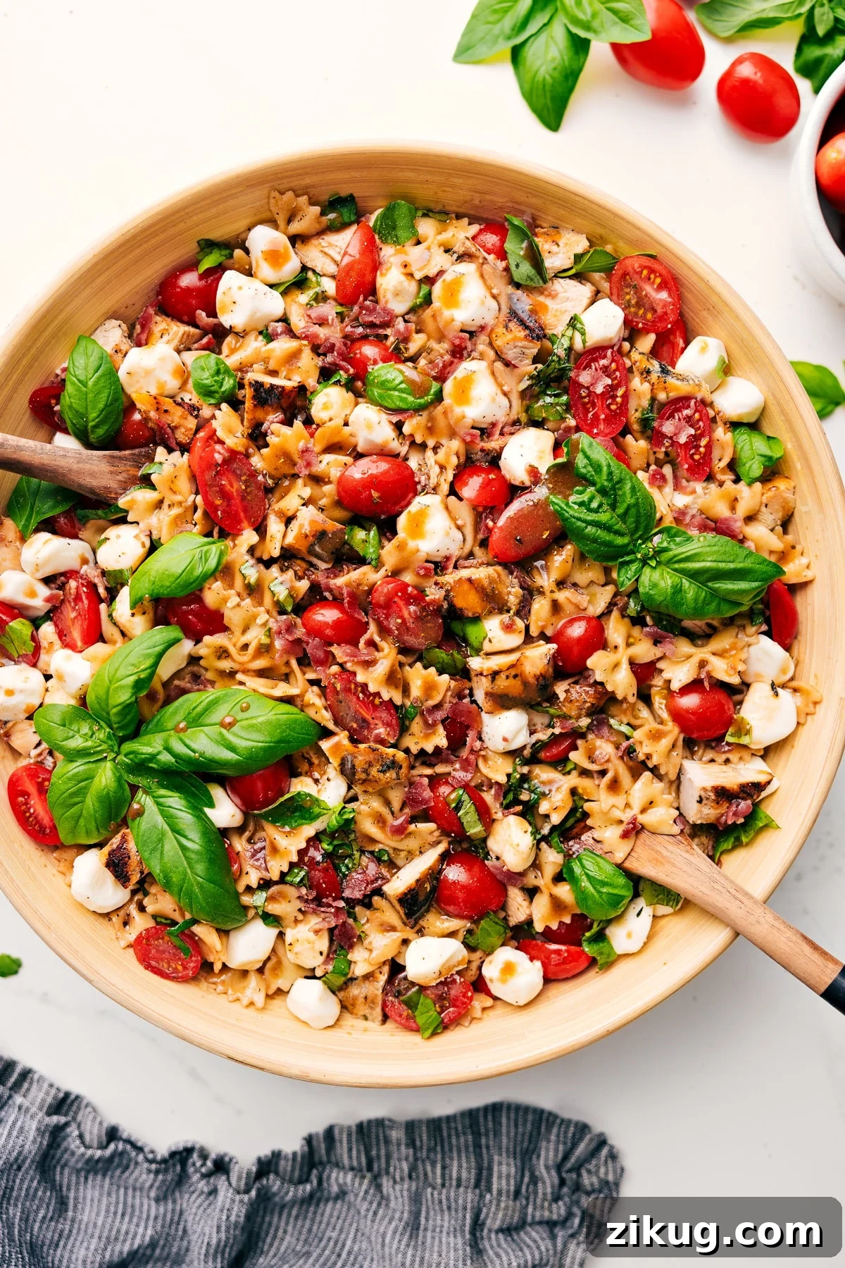 Caprese Pasta Salad Italian recipes Caprese pasta salad with chicken, bacon, tomatoes, mozzarella, basil, and balsamic.