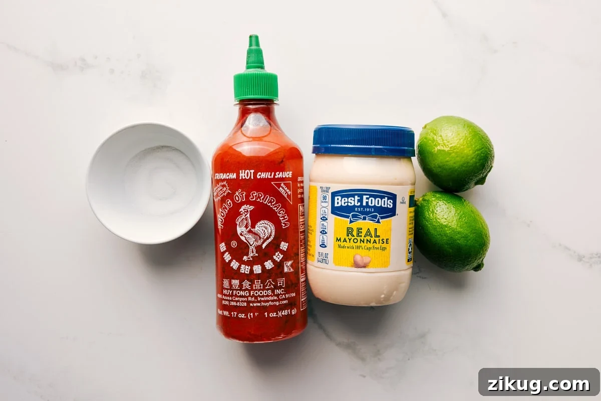 Ingredients In The Delicious Sauce Sugar, mayonnaise, lime, and sriracha prepped for easy assembly of the quick sauce.