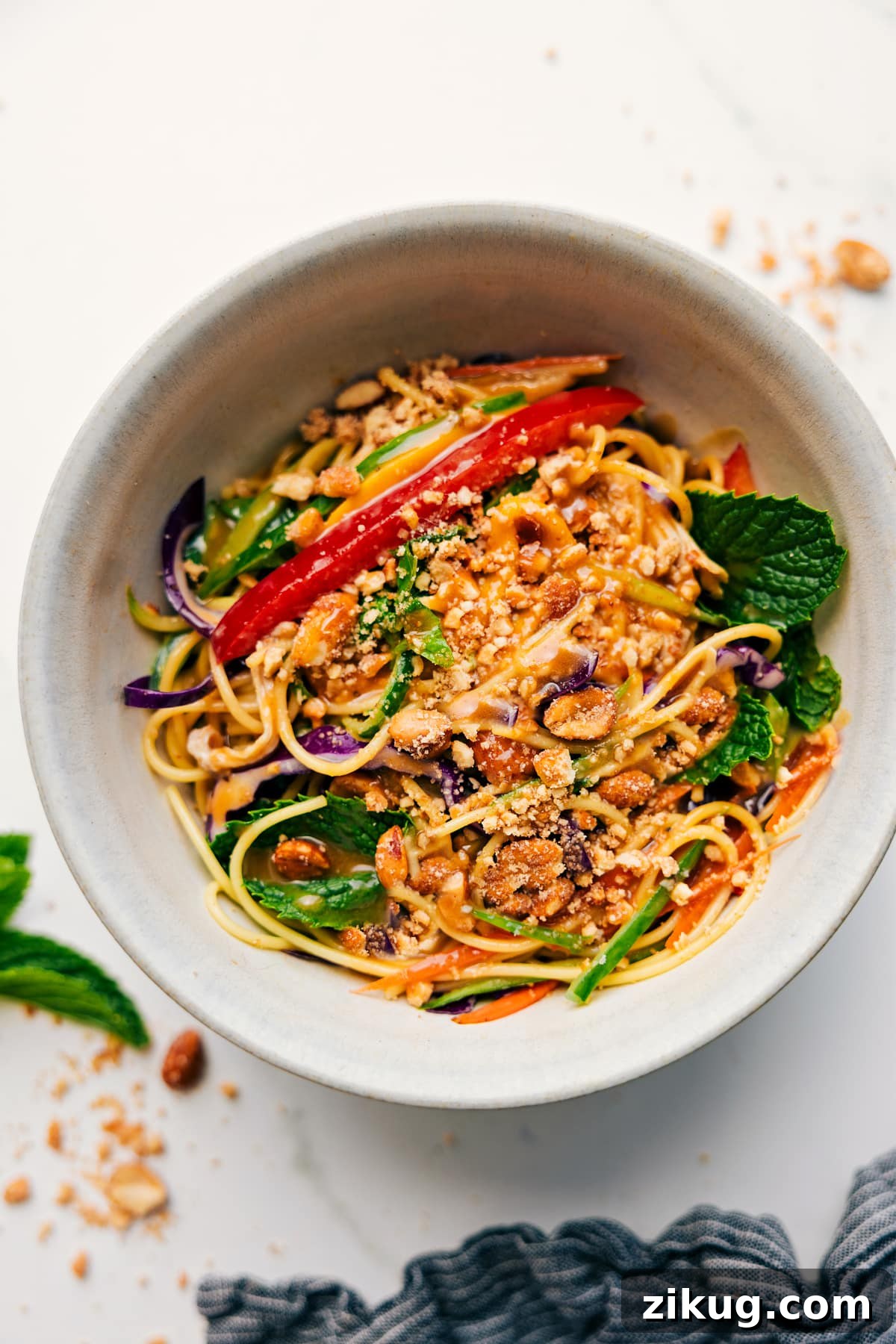 Fresh Vietnamese Spring Roll Salad with Peanut Dressing 2 Spring Roll Salad in a bowl topped with chopped peanuts, ready to eat.