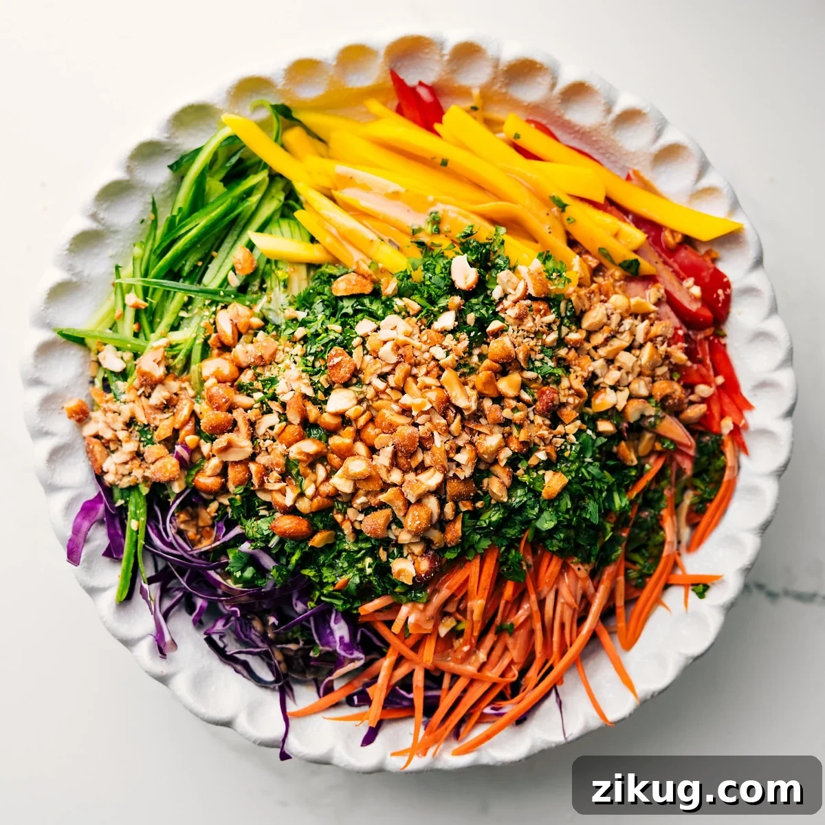 Fresh Vietnamese Spring Roll Salad with Peanut Dressing 5 Adding all the ingredients for this spring roll salad into a large bowl to dress and toss together.