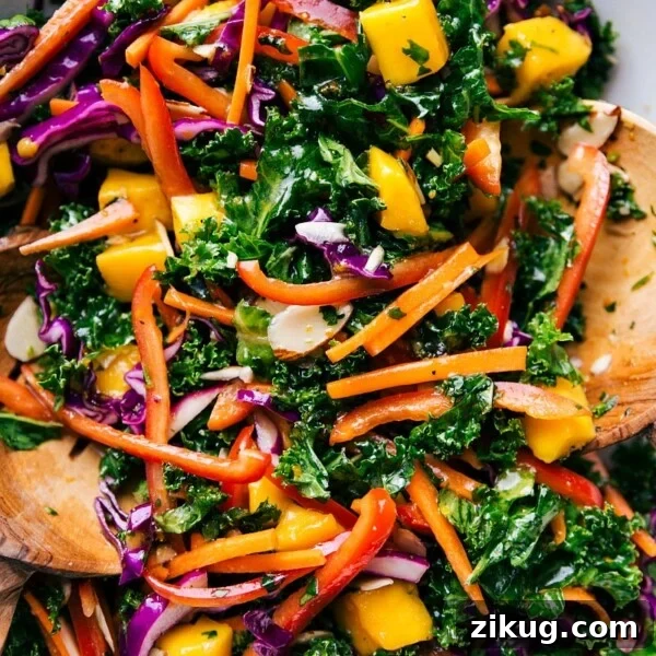Fresh Vietnamese Spring Roll Salad with Peanut Dressing 6 Colorful bowl of the completed kale salad recipe, complete with wooden serving spoons.