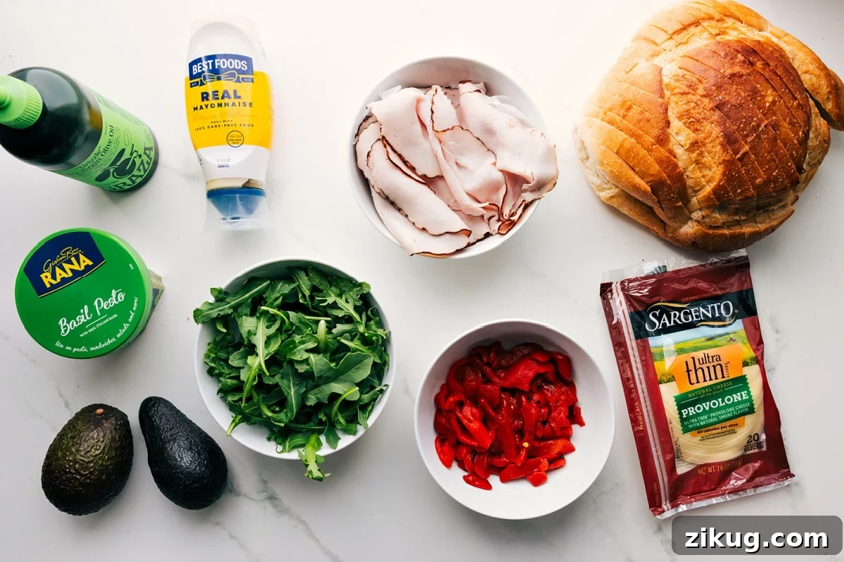 Panini Recipes: Flavorful Grilled Sandwich Ideas 4 All the ingredients in this recipe prepped out for easy assembly including the oil, pesto, avocado, arugula, turkey, roasted red peppers, provolone, and sourdough.