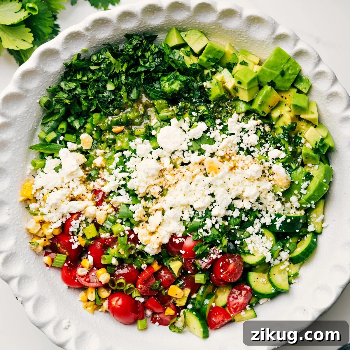 How To Make This Corn Salad Recipe All the ingredients in this corn salad recipe added into a bowl to be tossed together.