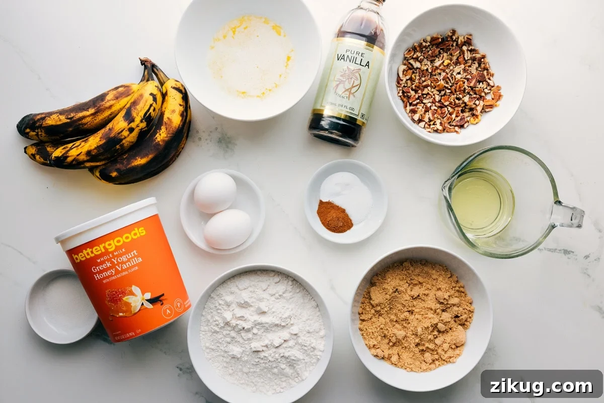 Ingredients In This Banana Nut Bread Recipe All the ingredients in this recipe prepped out for easy assembly including the bananas, yogurt, flour, sugar, oil, nuts, vanilla, spices, baking agents, eggs, and butter.
