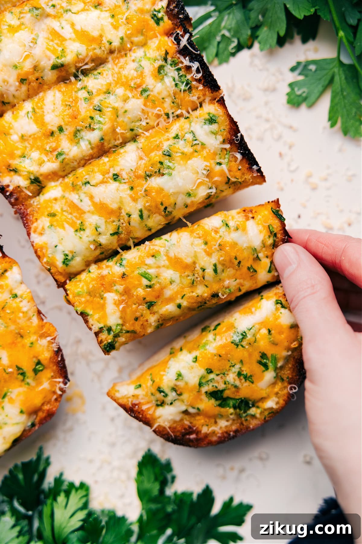 Cheesy Bread Recipe Garlic cheesy bread baked until golden and bubbly with deliciously crisp edges.