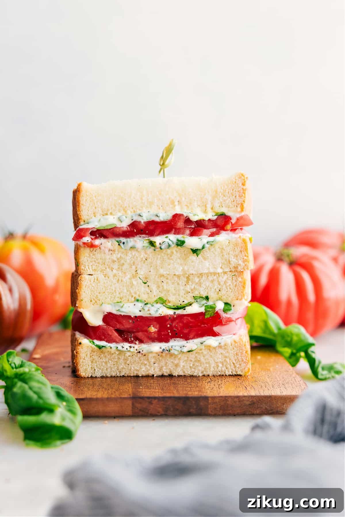 Unstuffed Peppers Recipes Tomato sandwich with thick tomatoes and basil mayo on soft white bread.