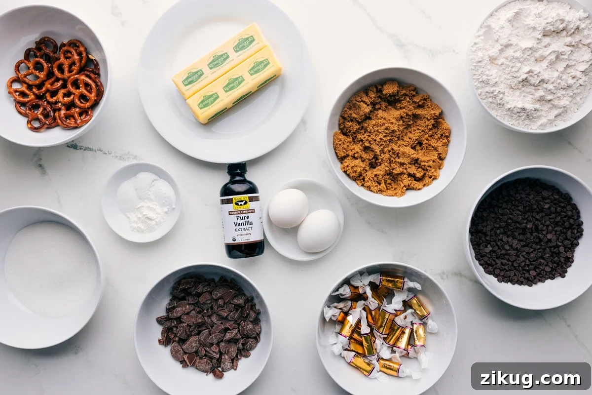 Loaded Kitchen Sink Cookies Recipe 4 All the ingredients in this recipe prepped out for easy assembly including the pretzels, butter, sugar, baking agents, chocolate, caramels, brown sugar, and flour.