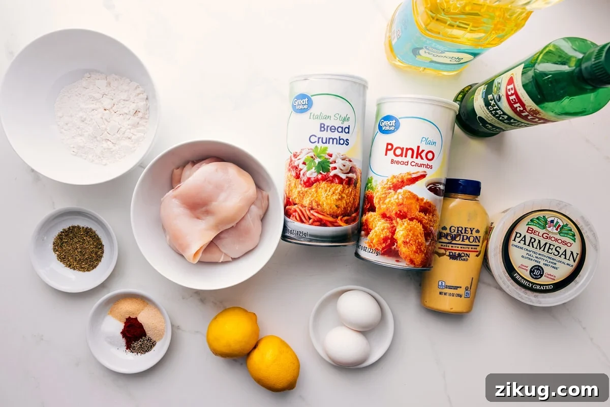 Crispy Chicken Milanese with Lemon Parsley Salad 4 All the ingredients in this recipe prepped out for easy assembly including the flour, seasonings, chicken, lemon, egg, bread crumbs, dijon, parmesan, and oil.