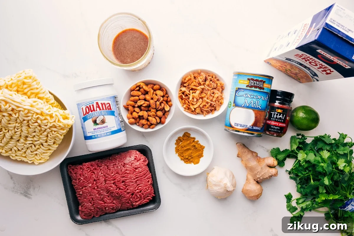 Fragrant Curry Broth for Soups and Noodles 4 All the ingredients in this recipe prepped out for easy assembly including the ramen, oil, beef, peanuts, sauce, fried onions, seasonings, garlic, ginger, coconut milk, red curry paste, lime, broth, and cilantro.