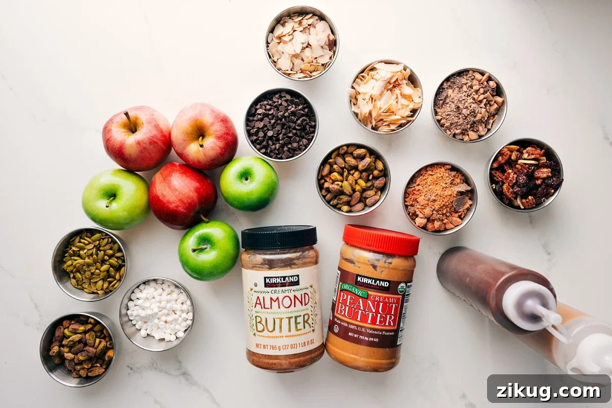 Cinnamon Apple Nachos with Caramel Drizzle 4 All the ingredients in this recipe prepped out for easy assembly including apples, pepitas, marshmallows, nuts, granola, chocolate, toffee bits, butterfingers, almond butter, peanut butter, chocolate, and caramel.