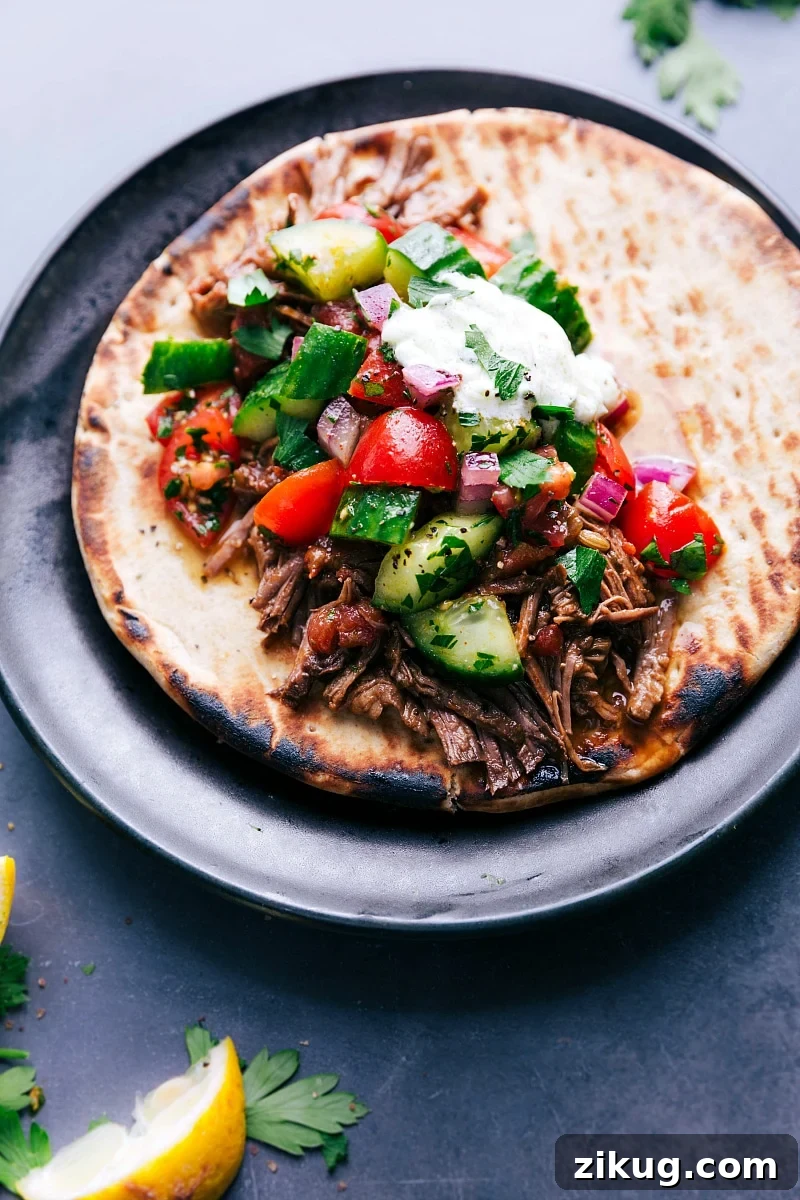 Low-Carb Burger Bowl Recipes Easy crockpot meals featuring juicy beef gyros on soft pita bread, topped with crisp fresh vegetables and a generous drizzle of tangy sauce, creating a flavorful and satisfying meal.