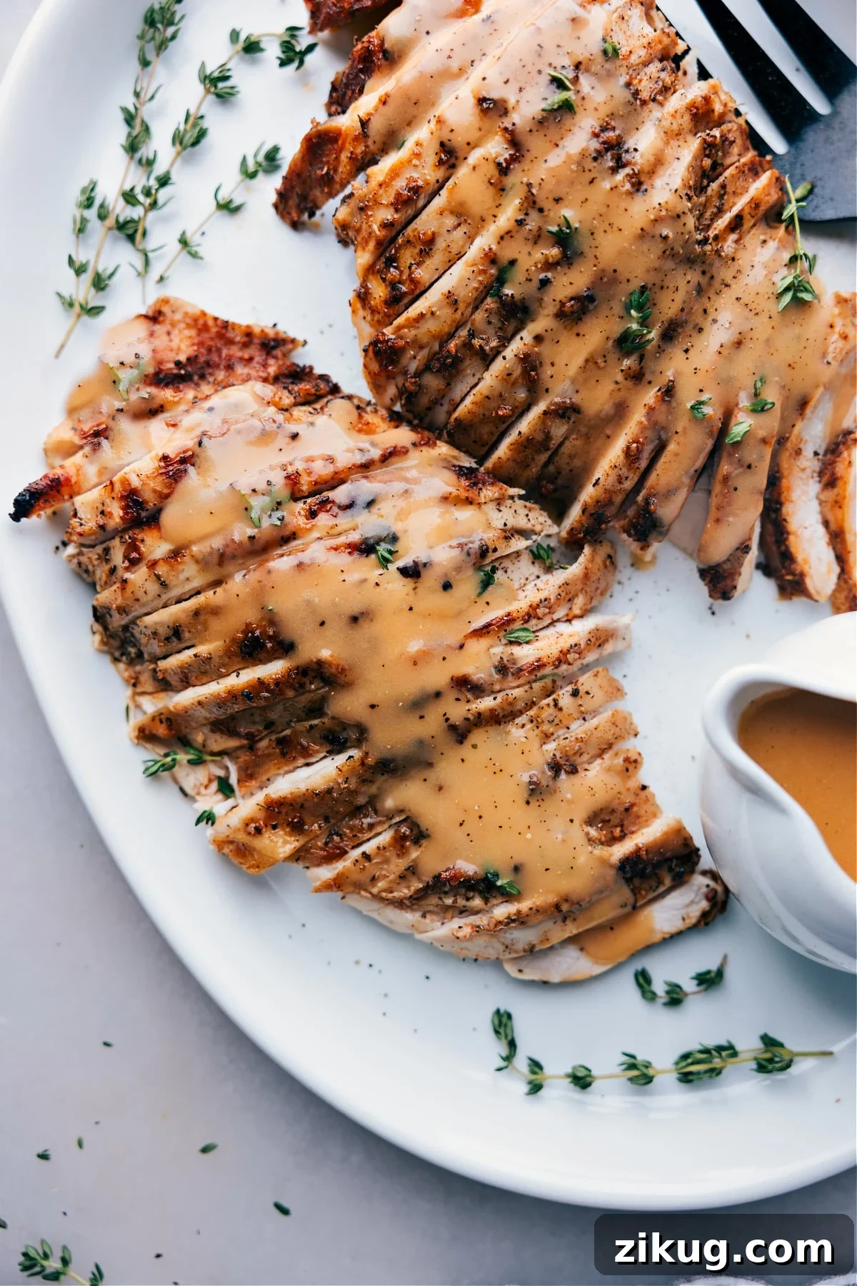 Low-Carb Burger Bowl Recipes Finished turkey covered in savory gravy, served on a plate, ready for enjoyment.