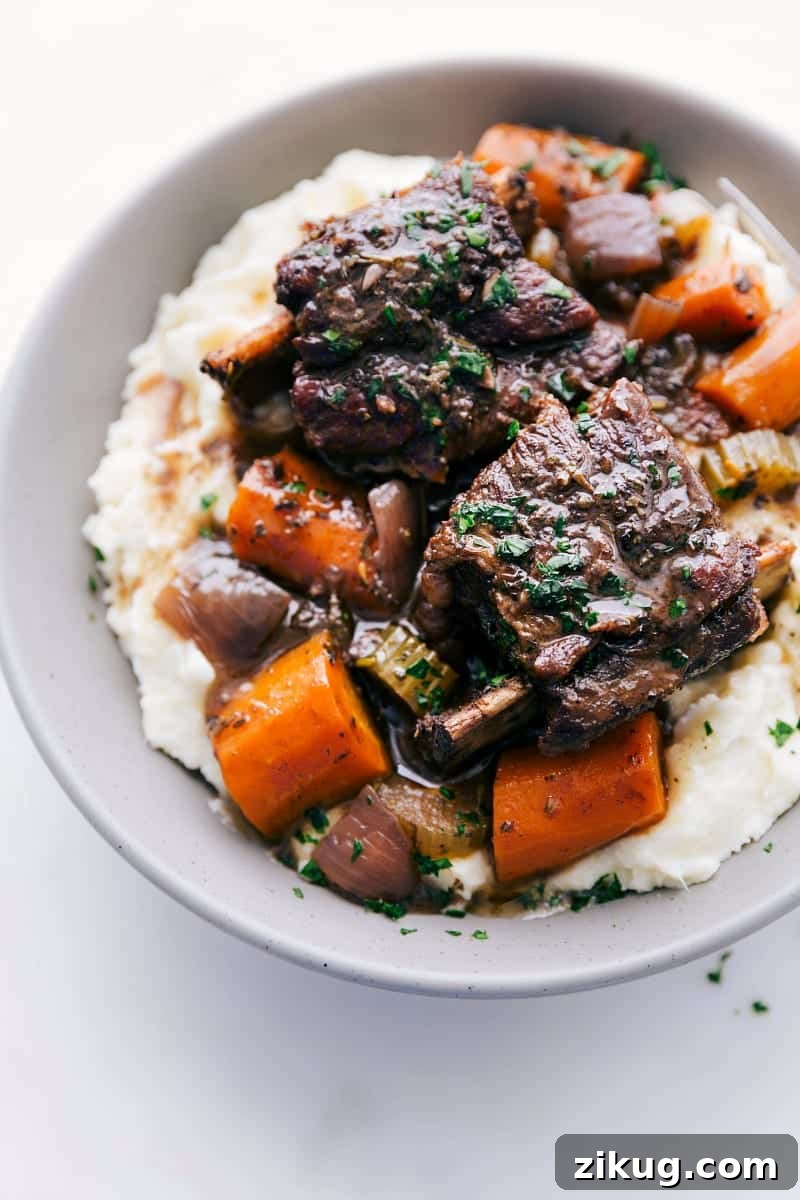 Low-Carb Burger Bowl Recipes Short ribs recipe fresh out of the slow cooker on a bed of mashed potatoes.