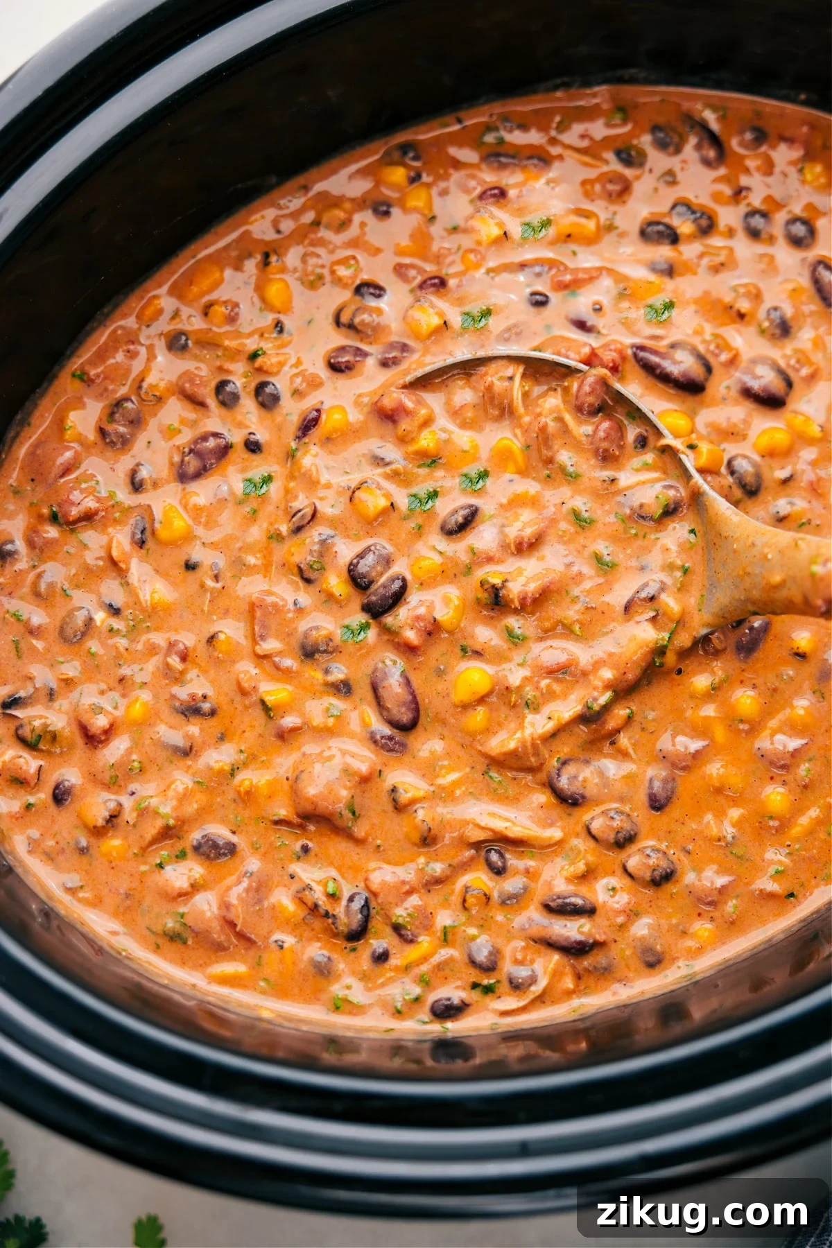 Juicy And Flavorful Chicken Recipes Chicken Taco Chili made in the slow cooker with tender chicken, beans, corn, and flavorful seasonings.