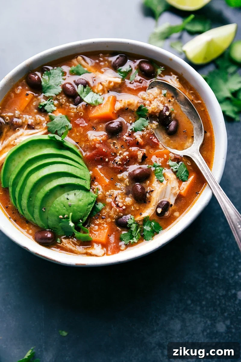 One Pan Mini Meatloaf Chicken Sweet Potato Soup with tender chicken and sweet potatoes topped with avocado and fresh herbs.