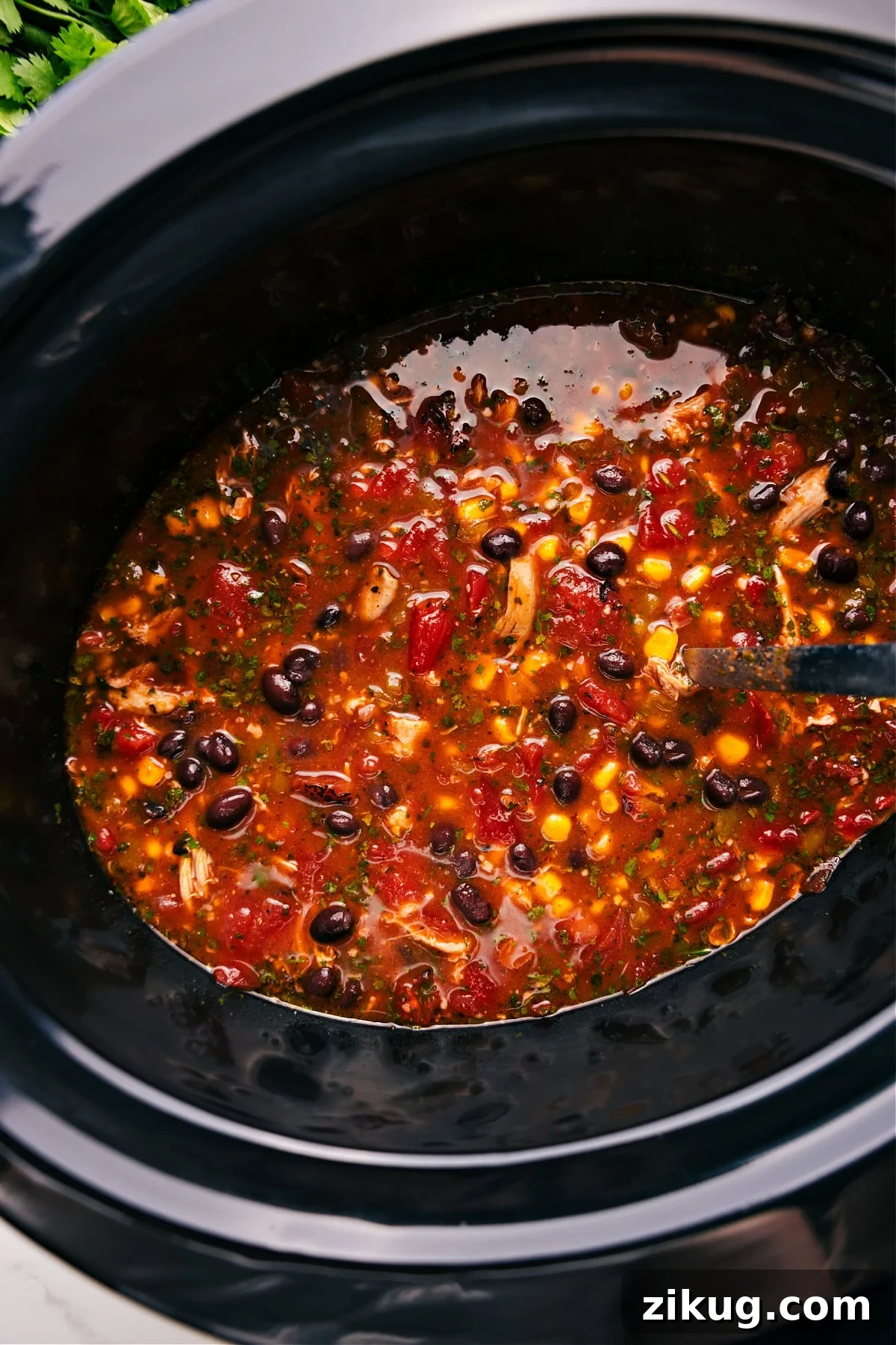 Taco Salad Recipe Easy crockpot meals featuring hearty Chicken Taco Soup topped with cheese, avocado, and crunchy tortilla chips.